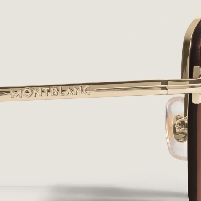 Lunettes de soleil ovales avec monture en métal doré